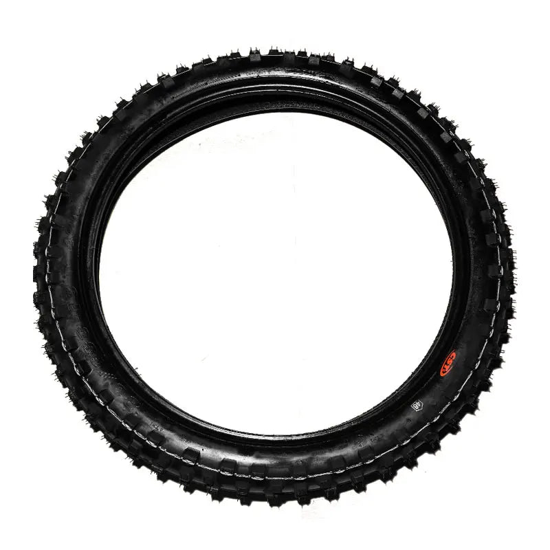 A black off-road dirt bike tire with a knobby tread, shown from a top-down view on a white background.